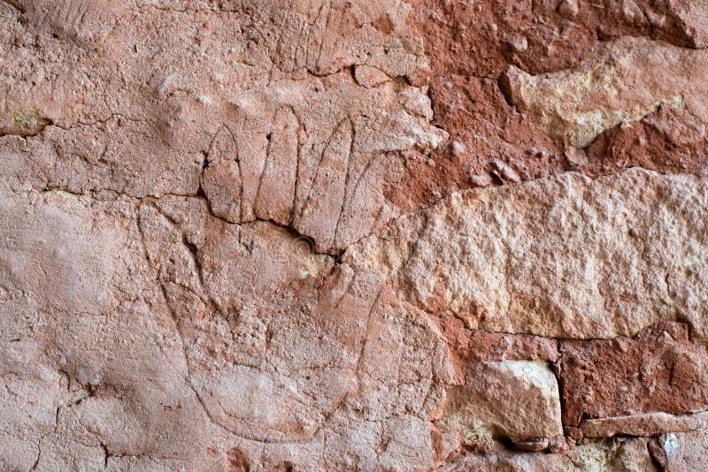 USA, Colorado, Montezuma County, Canyons of the Ancients National Monument. A Six Fingered Hand Etching in Plaster on the side of a pueblo. USA, Colorado, Montezuma County, Canyons of the Ancients National Monument. A Six Fingered Hand Etching in Plaster on the side of a pueblo
