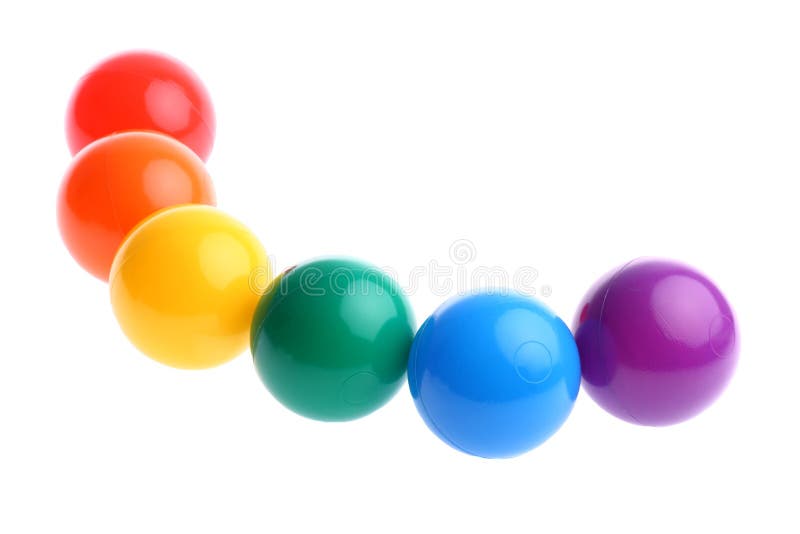 Seis esferas plásticas coloridas brilhantes do brinquedo na fileira fotos de stock royalty free Seis esferas plásticas coloridas brilhantes do brinquedo na fileira fotos de stock royalty free