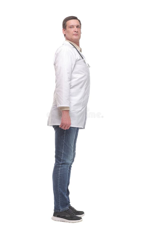 Seitenansicht voll selbstsicher männlicher Arzt in gleichmäßiger Kameraaufnahme lizenzfreies stockfoto