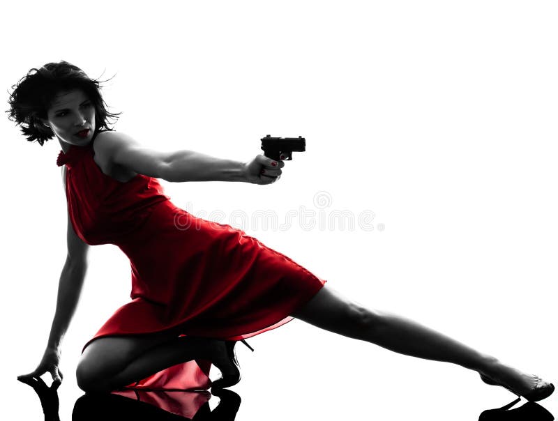 Seksowna kobiety mienia pistoletu sylwetka