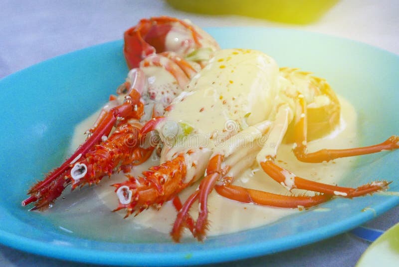 Selectieve nadruk van zeekreeftkok met boter royalty-vrije stock afbeelding