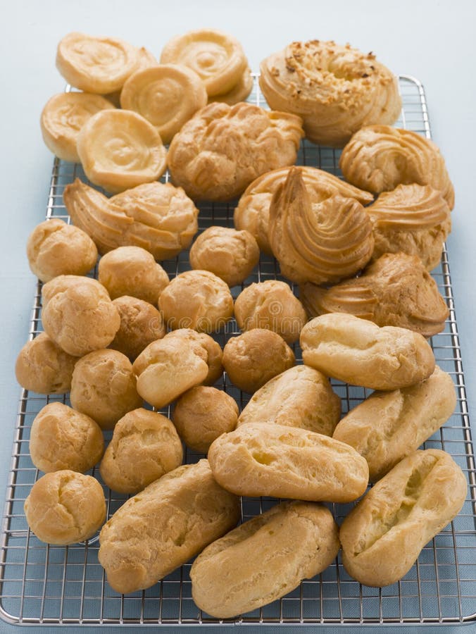 Selection of Choux Pastry Buns on a Cooling Rack