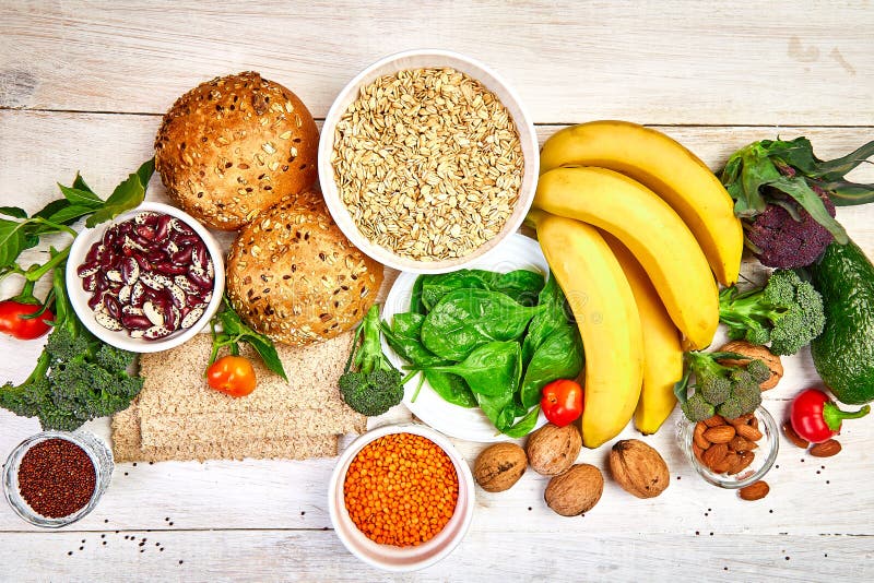 Selection food rich in fiber on white wooden background