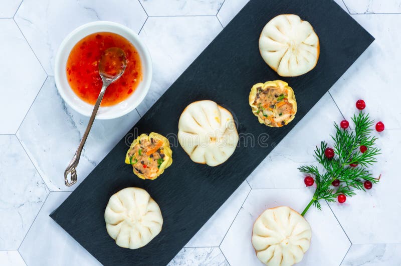 Selection of Mini Chinese Dumplings Dim Sum with Sweet Chili Dipping Sauce. Stock Image