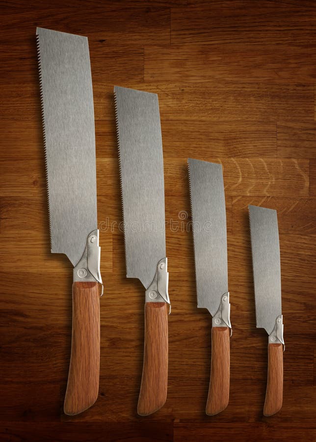A Selection of Precision Carpentry Hand Saws on a Wooden Board Stock