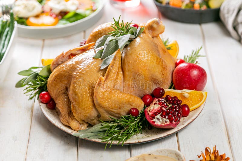 Selection of traditional thanksgiving food - turkey, mashed patatoes, green beans, apple pie on rustic background