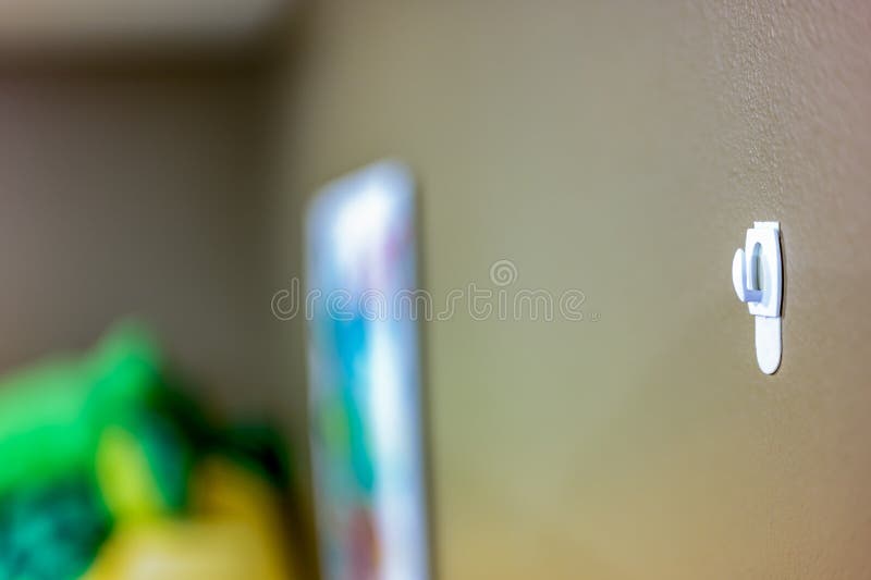 Selective Focus on Adhesive Strip Wall Hanger that Can Be Removed by  Pulling Tape Stock Photo - Image of hang, wall: 226246384