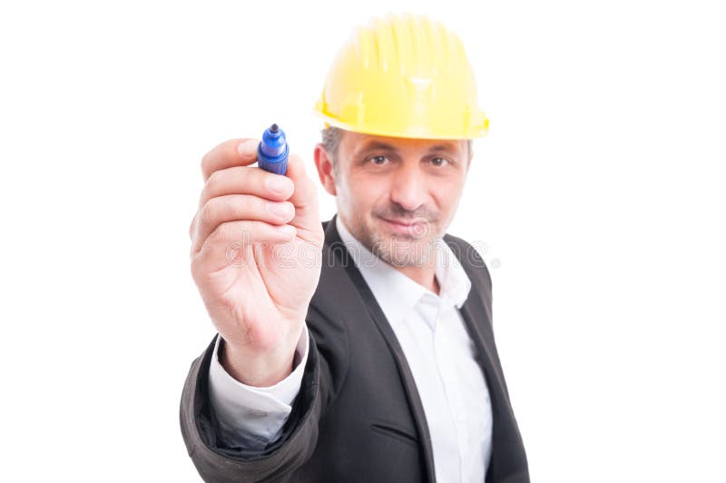 Selective focus of architect wearing hardhat writing with marker royalty free stock photography