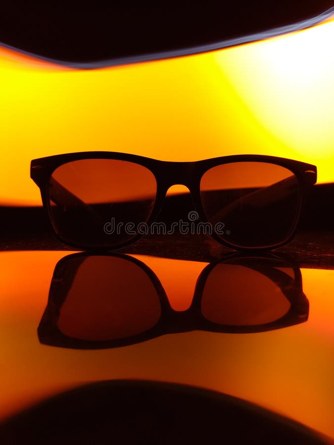 A black sunglasses on a colorful background. royalty free stock photos