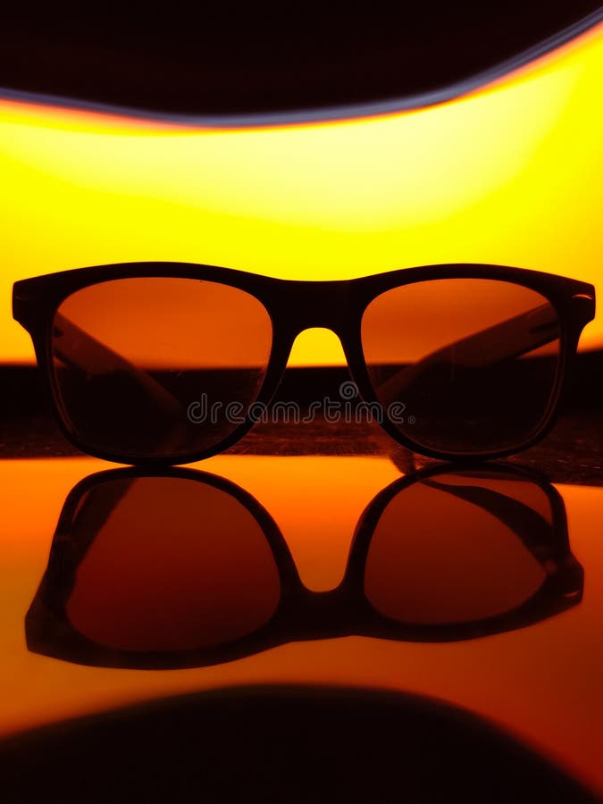 A black sunglasses on a black background. stock image
