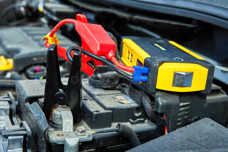 Charging a Car with Electricity through Cables from a Compact Battery