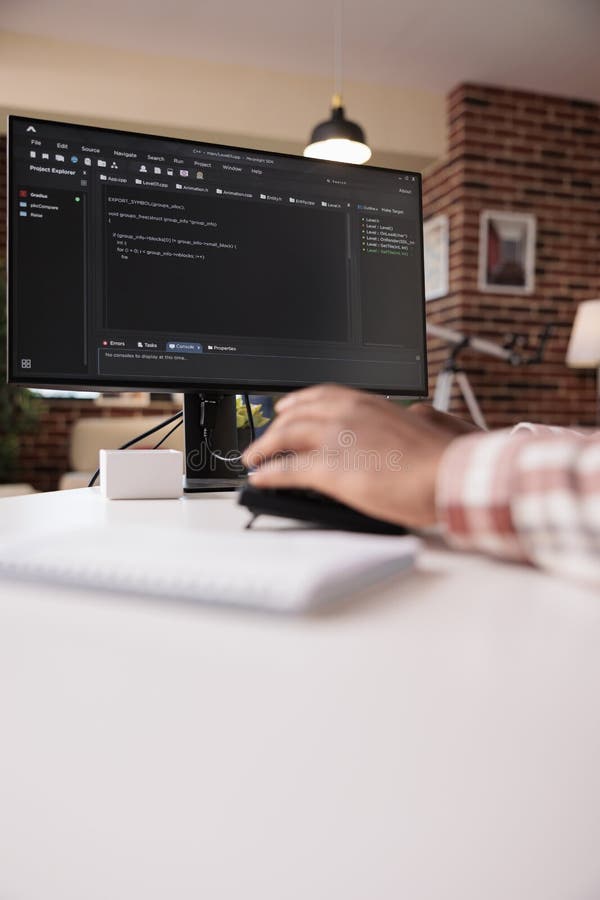 Selective focus on computer screen of african american programmer working remote from home royalty free stock images