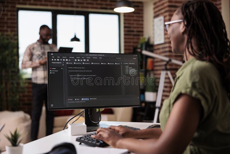 Selective focus on computer screen with programming language text of programmer working remote royalty free stock photos