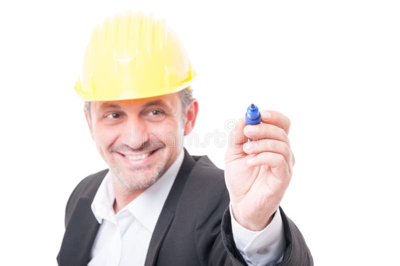 Selective focus of contractor wearing hardhat writing with marker royalty free stock image