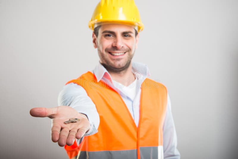 Selective focus of handsome architect holding house key stock photo