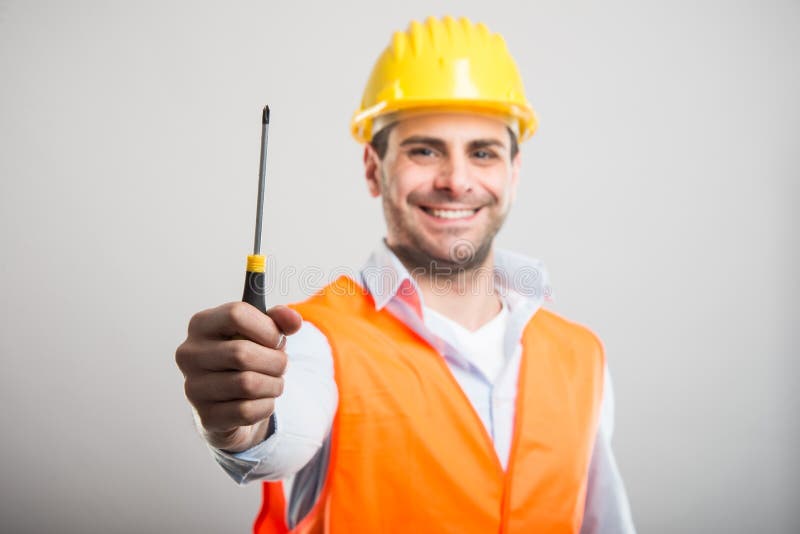 Selective focus of handsome architect holding one screwdriver stock images