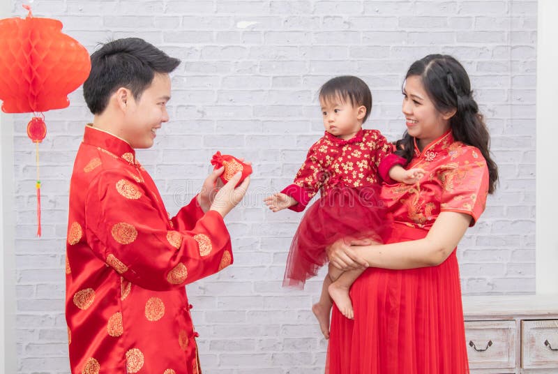 Selective Focus On Happy Father Provide Envelop Angpao For Kid Baby On  Chinese New Year Traditional Chinese Family Spent Time Stock Photo - Image  Of Family, Adult: 207313628