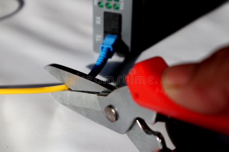 Selective Focus Scissors Cut Fiber Optic Network Cables. Cut the