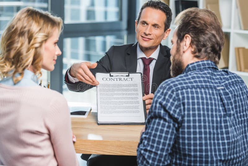 Lawyer Showing Contract To Clients Stock Image Image of suit, people 105242121