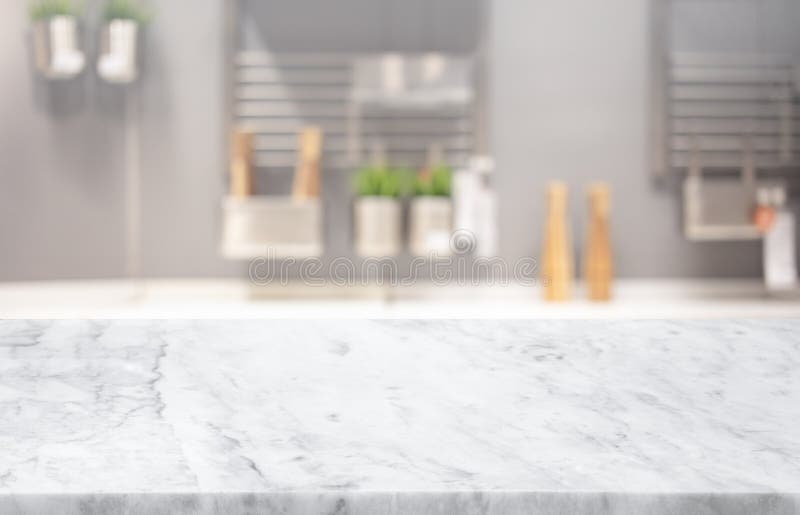Selective focus,Marble table top on blur white kitchen room background. F royalty free stock photo