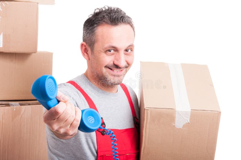 Selective focus of mover guy holding telephone receiver stock photography
