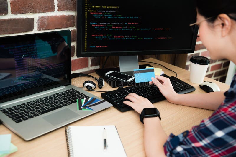 Selective focus photo of pretty female programmer royalty free stock images