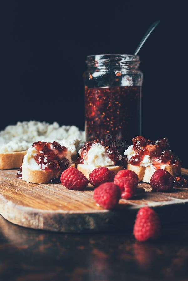 Selective Focus of Raspberries, Sandwiches with Fruit Jam and Cream
