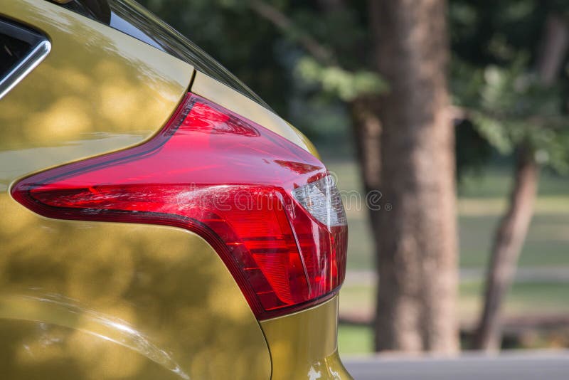 Selective Focus Rear Red Lights, Car Lights, Yellow Car Stock Image