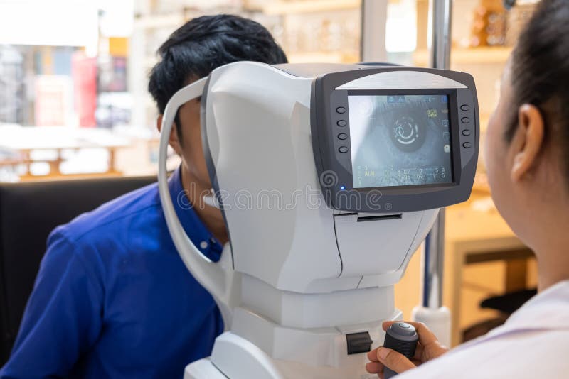 Selective Focus at Screen of Optometry Equipment. while Optometrist