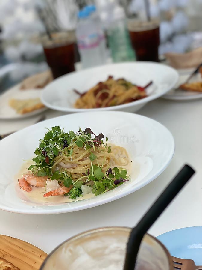 Selective focus shot of an appetizing pasta with shrimps stock photos