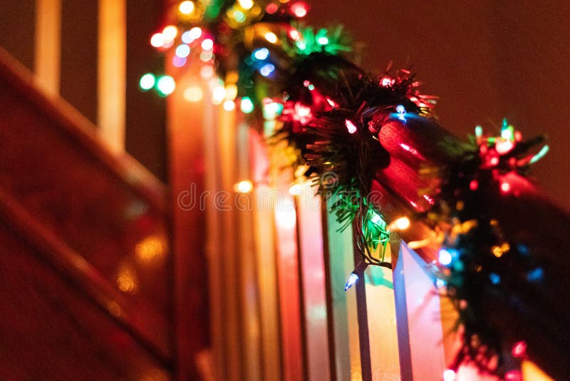 Selective Focus Shot of Christmas Lights Wrapped Around a Wooden