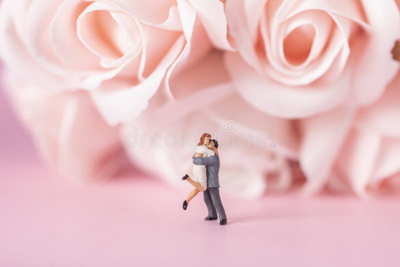 Selective Focus Shot of a Hugging Couple Miniature Figurine Stock Image