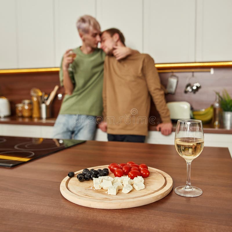 Selective Focus On Snacks And Wine With Couple Kissing Stock Image