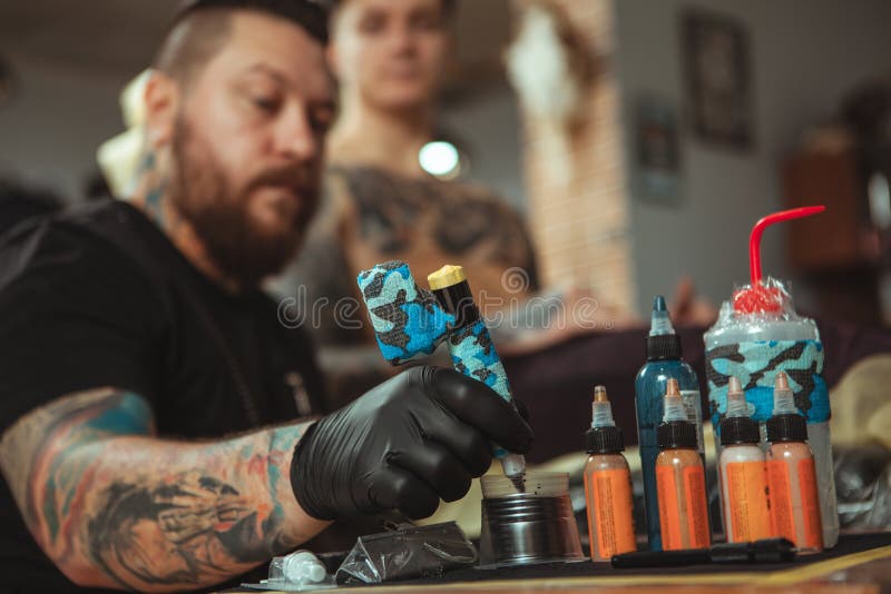 Professional Tattoo Artist Doing a New Tattoo for His Client Stock Image -  Image of parlor, design: 141403359