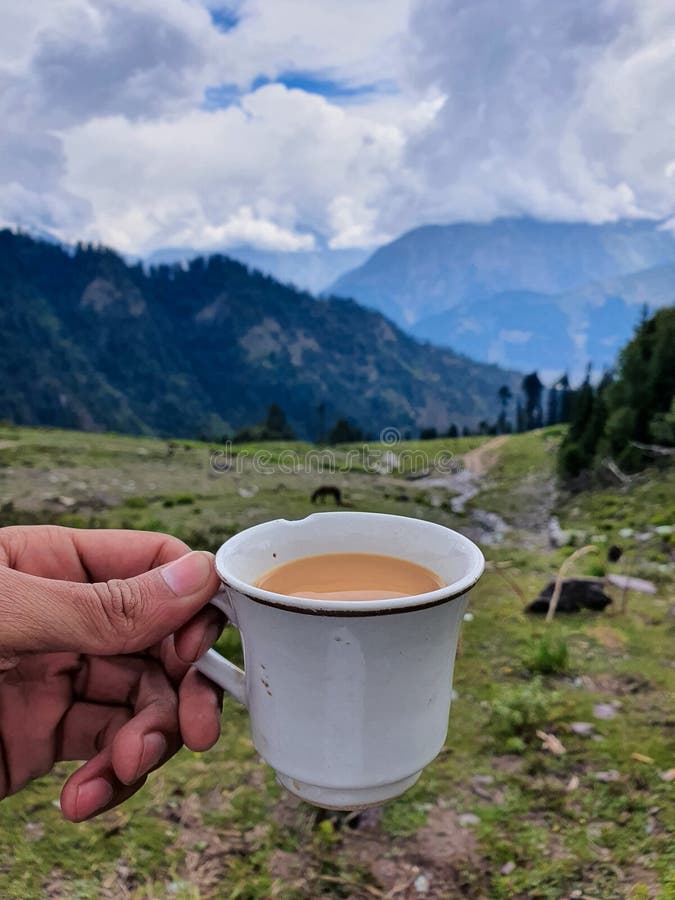 A Selective Focus on Tea Cup at Blur Top Mountain View of Kalam Valley ...