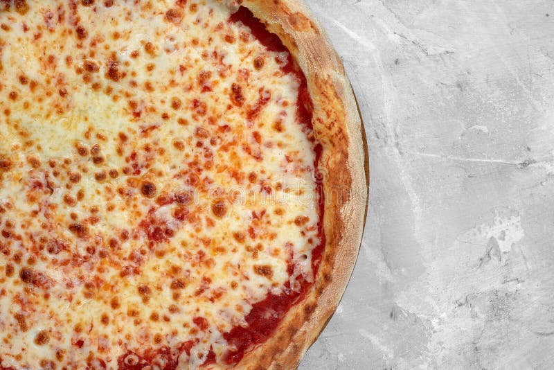 Selective Focus Traditional Stonebaked Pizza Margarita on Stone Table