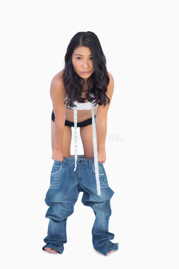 Self Confident Woman Wearing Jeans Falling Down because Shes Los Stock  Image - Image of denim, adult: 32879277