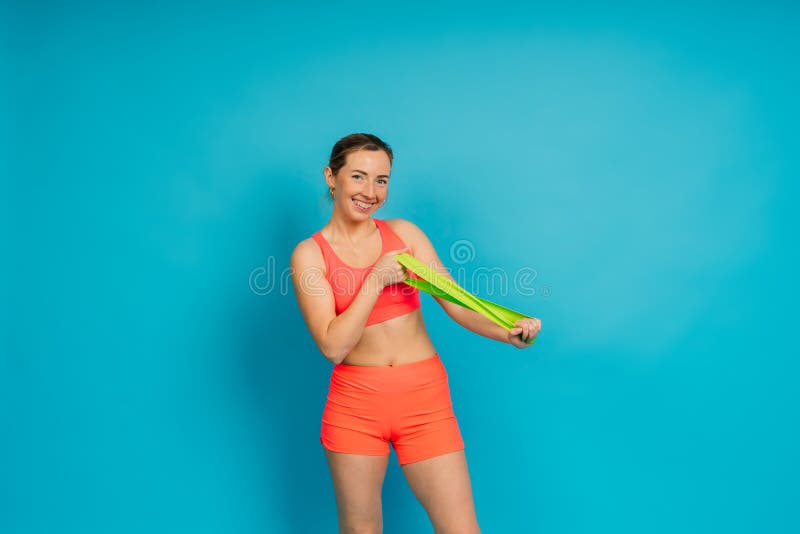 Self Determined Bodybuilder Does Exercises with Rubber Band, Works on