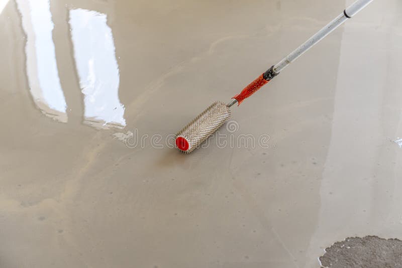 Selfleveling Epoxy. Leveling with a Mixture of Cement Floors Stock