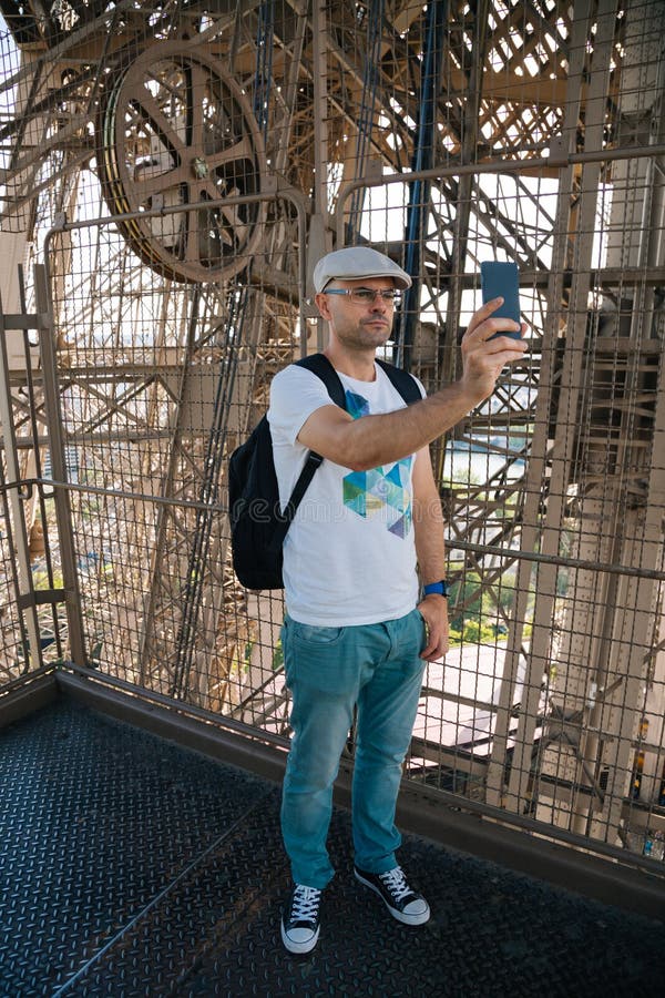 Selfie man inside the Eiffel Tower royalty free stock images