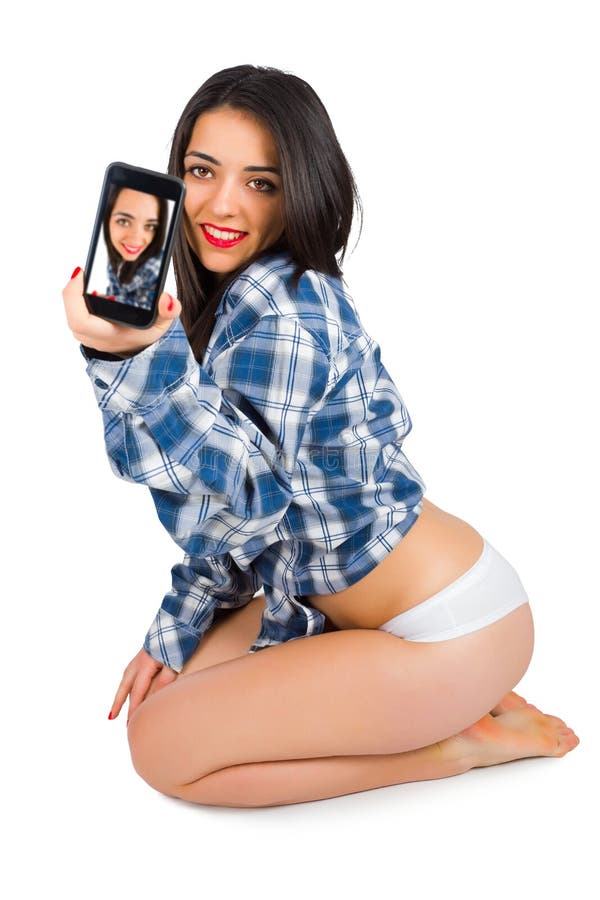 brunette lady taking selfies in man shirt - isolated iamge. brunette lady taking selfies in man shirt - isolated iamge.