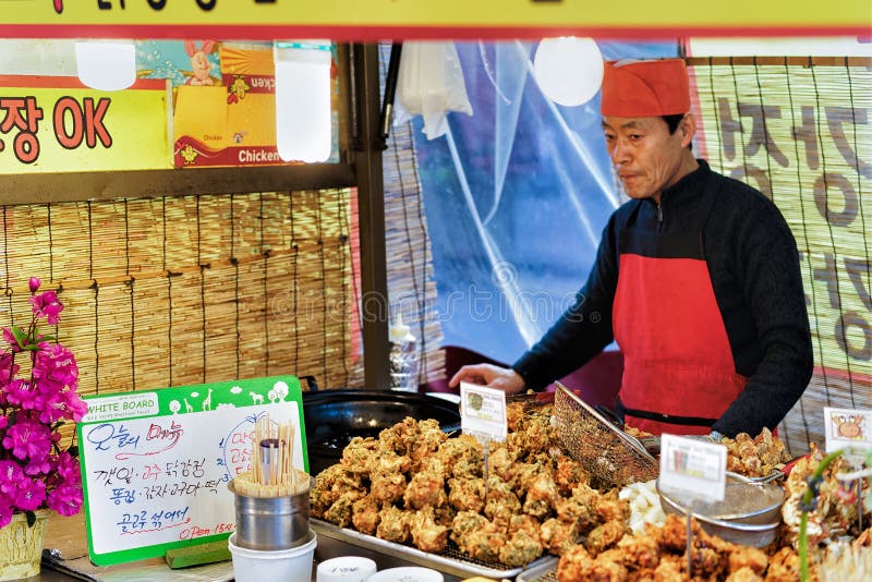 Seller of Street Food in Myeongdong Street Market in Seoul Editorial