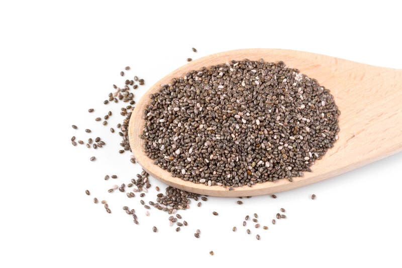 Sementes de Chia em uma colher de madeira foto de stock Sementes de Chia em uma colher de madeira foto de stock