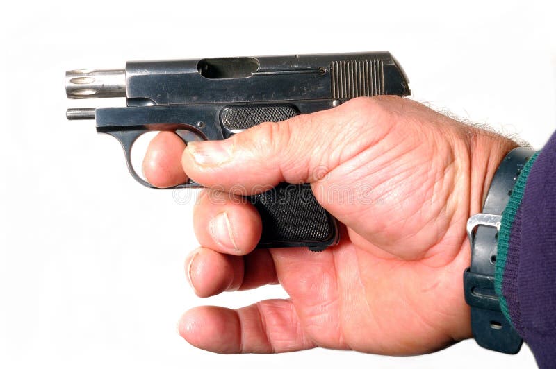 Small semi-automatic pistol in hand isolated