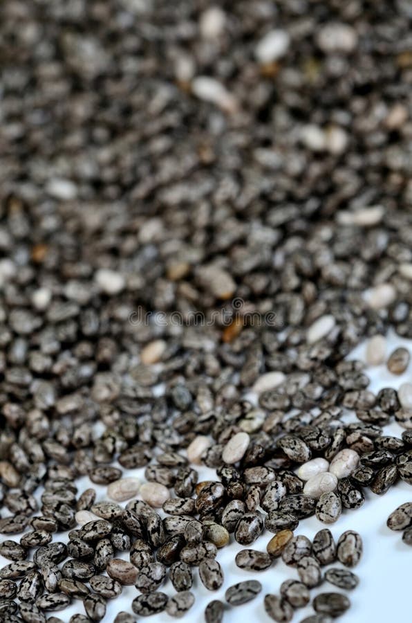 Semillas de Chia en fondo fotografía de archivo Semillas de Chia en fondo fotografía de archivo