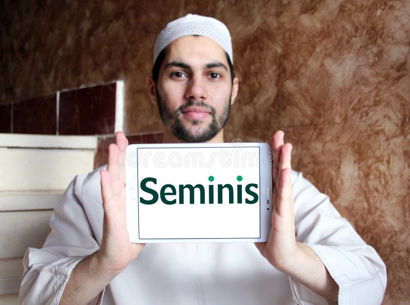 Logo of Seminis company on samsung tablet holded by arab muslim man. Seminis is the largest developer, grower and marketer of fruit and vegetable seeds in the world. Logo of Seminis company on samsung tablet holded by arab muslim man. Seminis is the largest developer, grower and marketer of fruit and vegetable seeds in the world