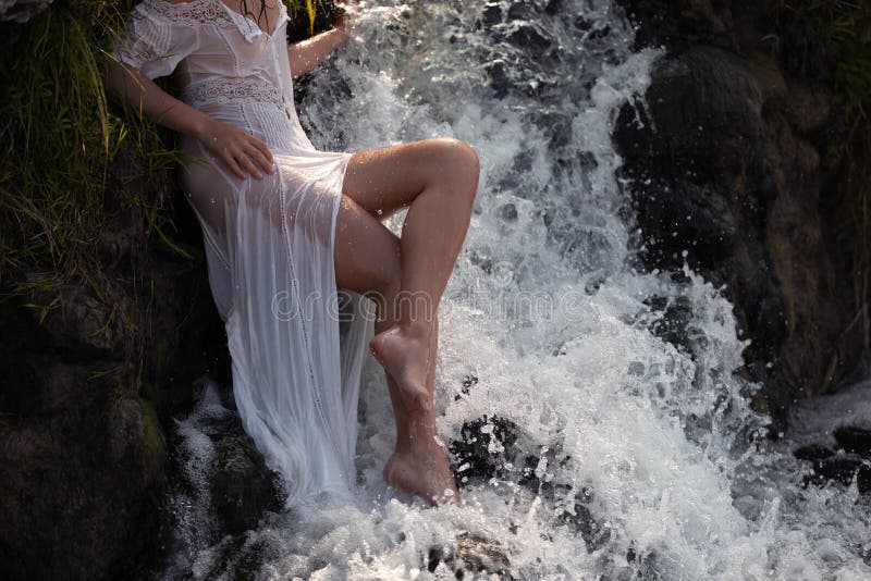 Seminude Woman in a Waterfall Stock Photo picture