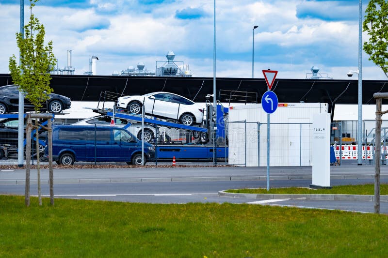 semi-truck transports loaded new Tesla vehicles leaving Gigafactory Berlin-Brandenburg manufacturing plant, Logistics and delivery services, Ev distribution, Berlin - April 26, 2024. semi-truck transports loaded new Tesla vehicles leaving Gigafactory Berlin-Brandenburg manufacturing plant, Logistics and delivery services, Ev distribution, Berlin - April 26, 2024