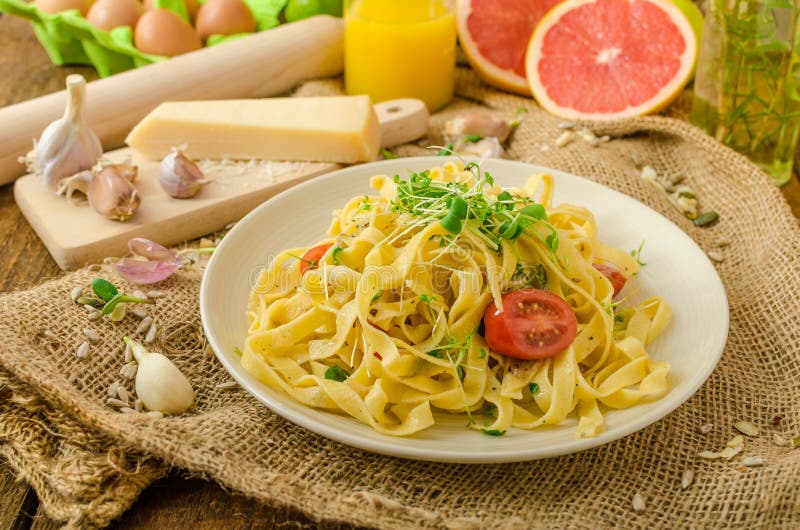 Semolina Pasta with Roasted Garlic, Sprinkled Microherbs Stock Photo