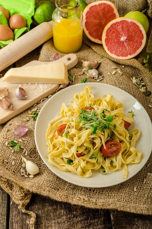 Semolina Pasta With Roasted Garlic, Sprinkled Microherbs Stock Image